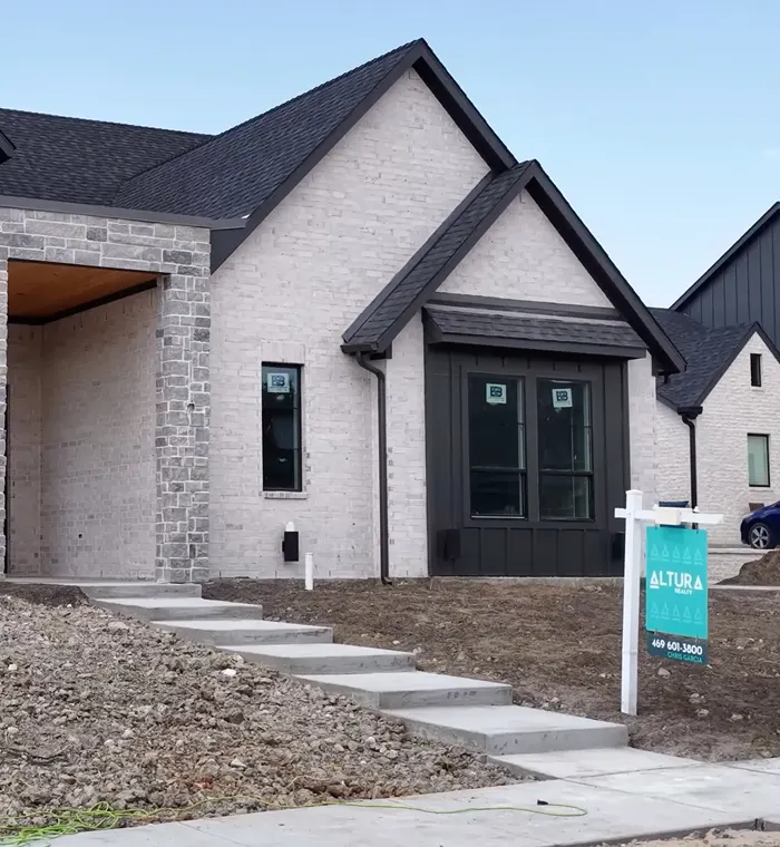 New construction home with an Altura Realty yard sign