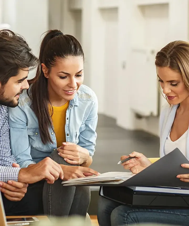Altura agent reviewing documents with clients